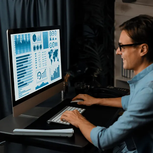 Construction CFO and IT director interviewing a candidate to hire a Vista Crystal Reports developer, with a job cost report on screen.